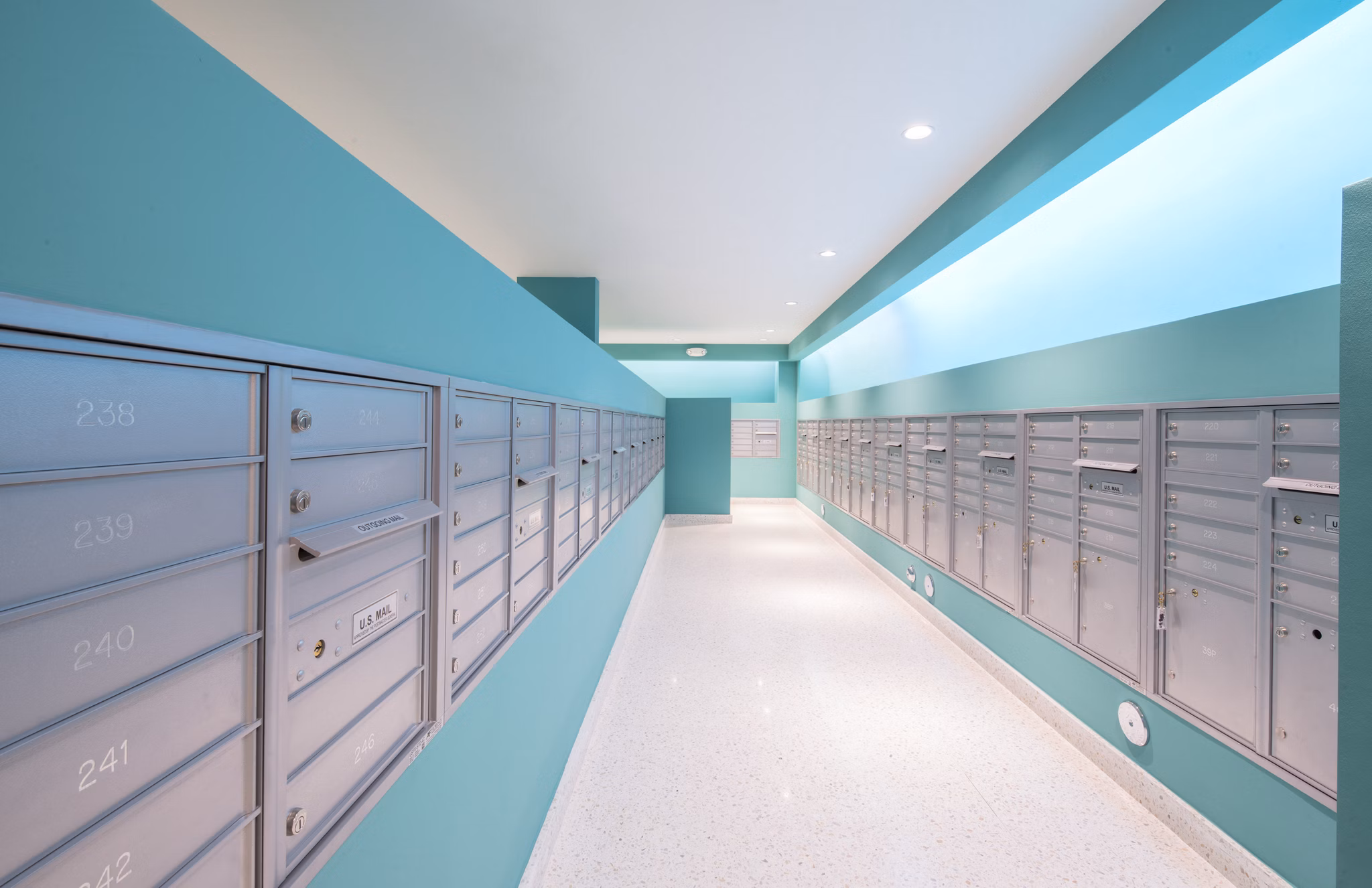 Modern mail room featuring secure package lockers at SoMa at Brickell Apartments