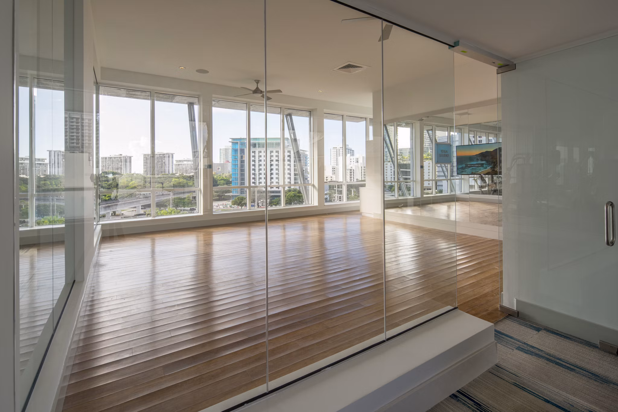 Yoga/spin studio equipped with modern fitness gear at SoMa at Brickell Apartments