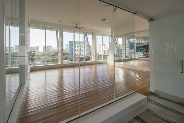 Yoga/spin studio equipped with modern fitness gear at SoMa at Brickell Apartments