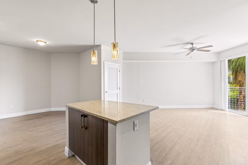 Modern kitchen with sleek cabinetry and stainless steel appliances at SoMa at Brickell Apartments