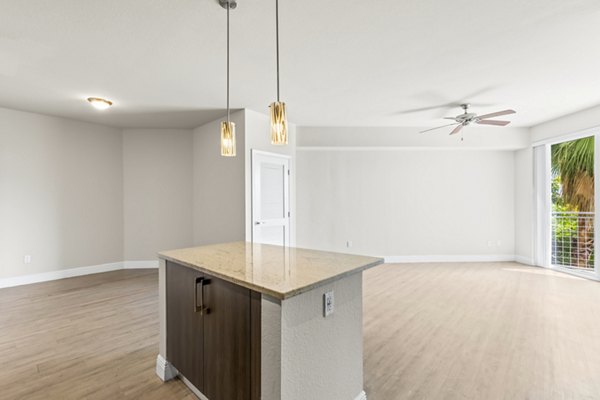 Modern kitchen with sleek cabinetry and stainless steel appliances at SoMa at Brickell Apartments