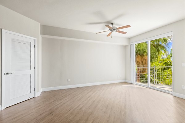 Spacious living room with modern decor at SoMa at Brickell Apartments