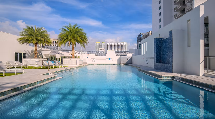 Luxury swimming pool area at SoMa at Brickell Apartments offering premium relaxation and leisure facilities