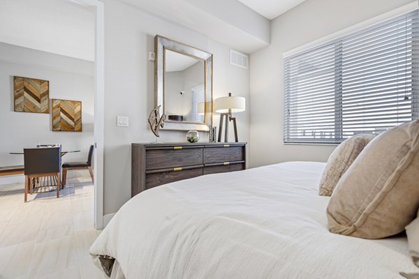 Cozy bedroom with modern decor at Boca City Walk Apartments