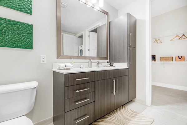 Boca City Walk Apartments: Elegant bathroom featuring marble countertops and modern fixtures in luxury Boca Raton apartments