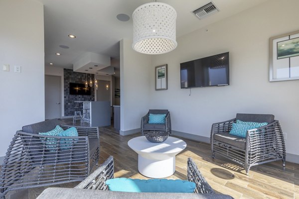 Clubhouse with modern seating and communal workspaces at Boca City Walk Apartments