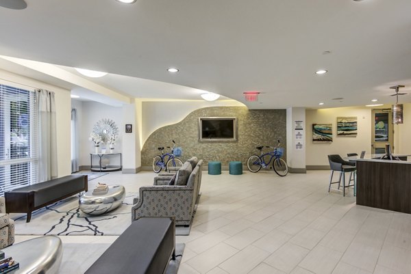 Clubhouse with modern design and seating areas at Boca City Walk Apartments