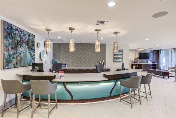 Clubhouse featuring modern design and comfortable seating at Boca City Walk Apartments