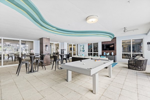 Clubhouse with modern design and seating areas at Boca City Walk Apartments in Boca Raton