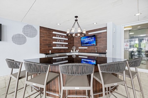 Clubhouse featuring elegant decor and seating at Boca City Walk Apartments in a Greystar luxury community