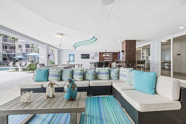Clubhouse with modern furnishings at Boca City Walk Apartments, offering a luxurious setting for residents to relax and socialize