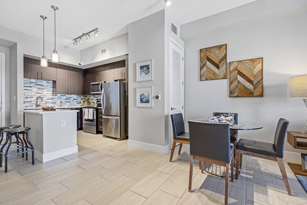 Boca City Walk Apartments: Dining area with modern furnishings and ambient lighting