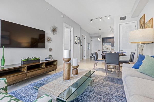 Welcoming living room with plush seating and modern decor at Boca City Walk Apartments