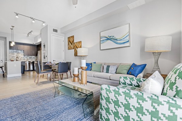 Spacious living room with modern furnishings at Boca City Walk Apartments