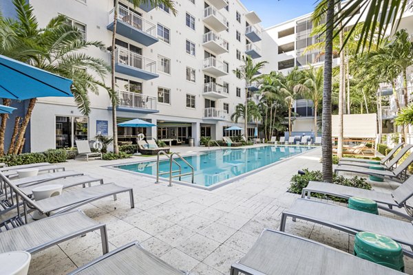 Boca City Walk: Sparkling pool with sunbathing deck at luxury apartments in an upscale neighborhood