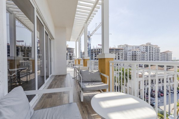 Boca City Walk Apartments: Cozy patio with modern furniture in luxury apartment community