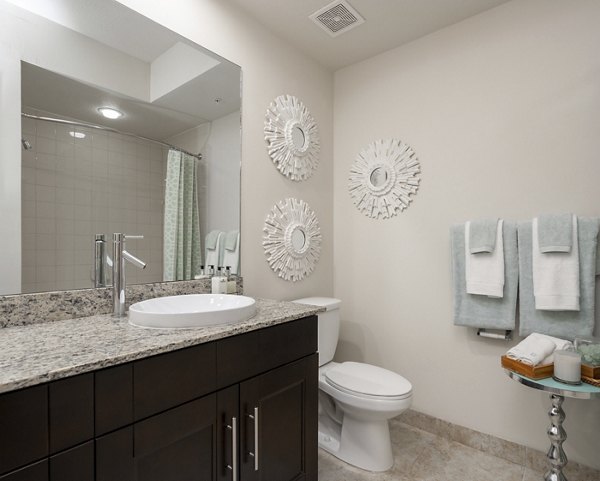 Modern bathroom with sleek fixtures at The Franklin Delray Apartments