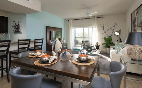 Dining area with modern decor and elegant lighting at The Franklin Delray Apartments