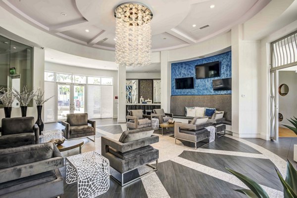 Modern clubhouse with contemporary furnishings at The Franklin Delray Apartments, offering luxury living experience