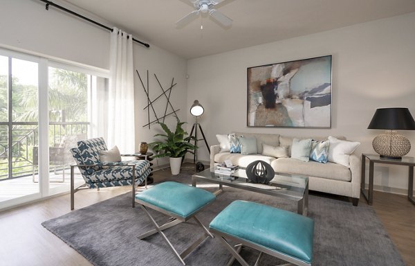 Spacious living room with modern furnishings at The Franklin Delray Apartments