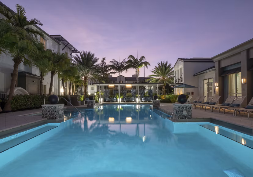 Rooftop pool with lounge seating at The Franklin Delray Apartments, offering luxury living and relaxation spaces
