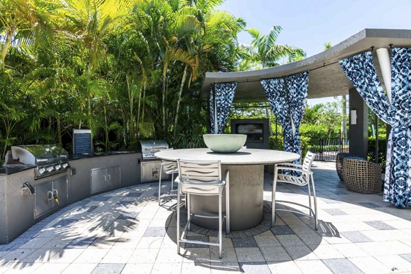 Outdoor grill area with modern appliances at The Franklin Delray Apartments, a Greystar luxury community in Delray Beach