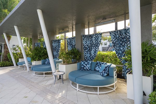 Chic outdoor patio with elegant seating at The Franklin Delray Apartments, a luxury property offering relaxation and style