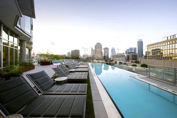 Stunning rooftop pool with panoramic city views at SEVEN Apartments, a luxury Greystar property