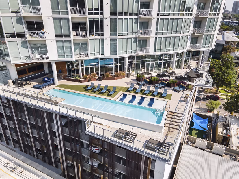 Rooftop infinity pool with skyline view at SEVEN Apartments, luxury living in downtown