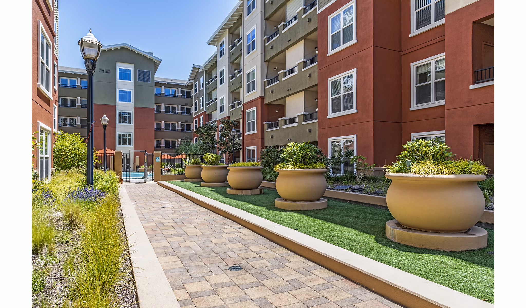 Acappella Apartments: Lush courtyard with seating and fountains at luxury apartments in a peaceful community