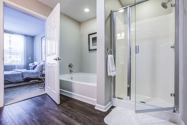 Modern bathroom with sleek fixtures at Acappella Apartments featuring luxury design elements and spacious layout