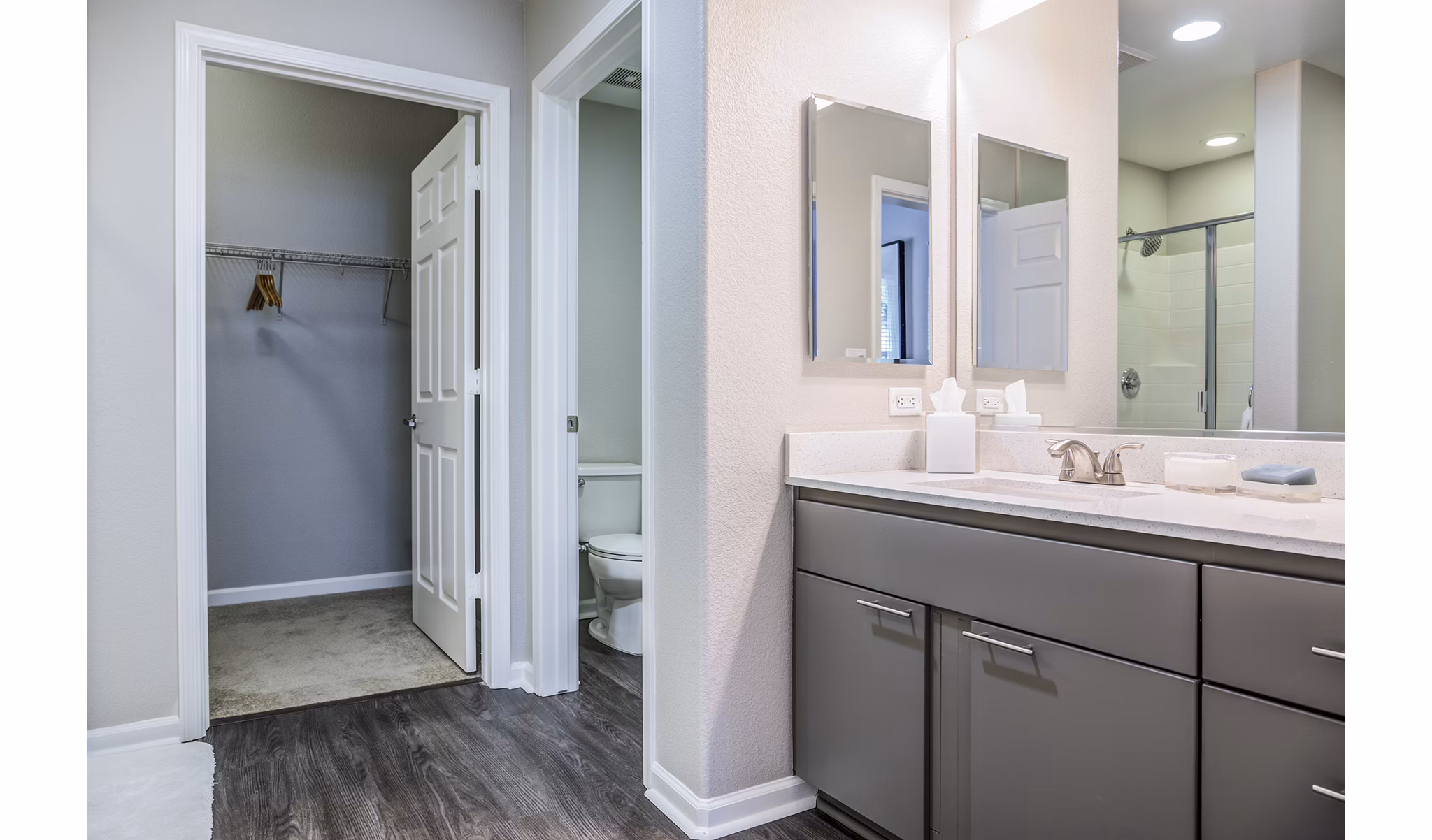 Modern bathroom with marble countertops at Acappella Apartments