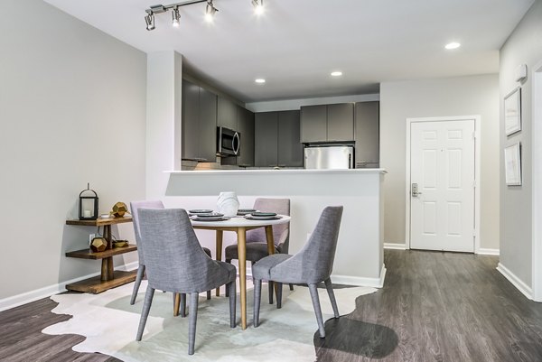 Dining room featuring modern furniture and elegant lighting at Acappella Apartments