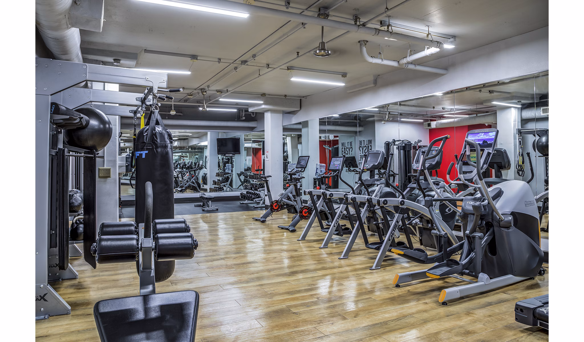 Modern fitness center featuring advanced equipment at Acappella Apartments