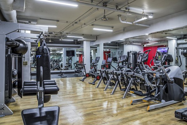 Modern fitness center featuring advanced equipment at Acappella Apartments