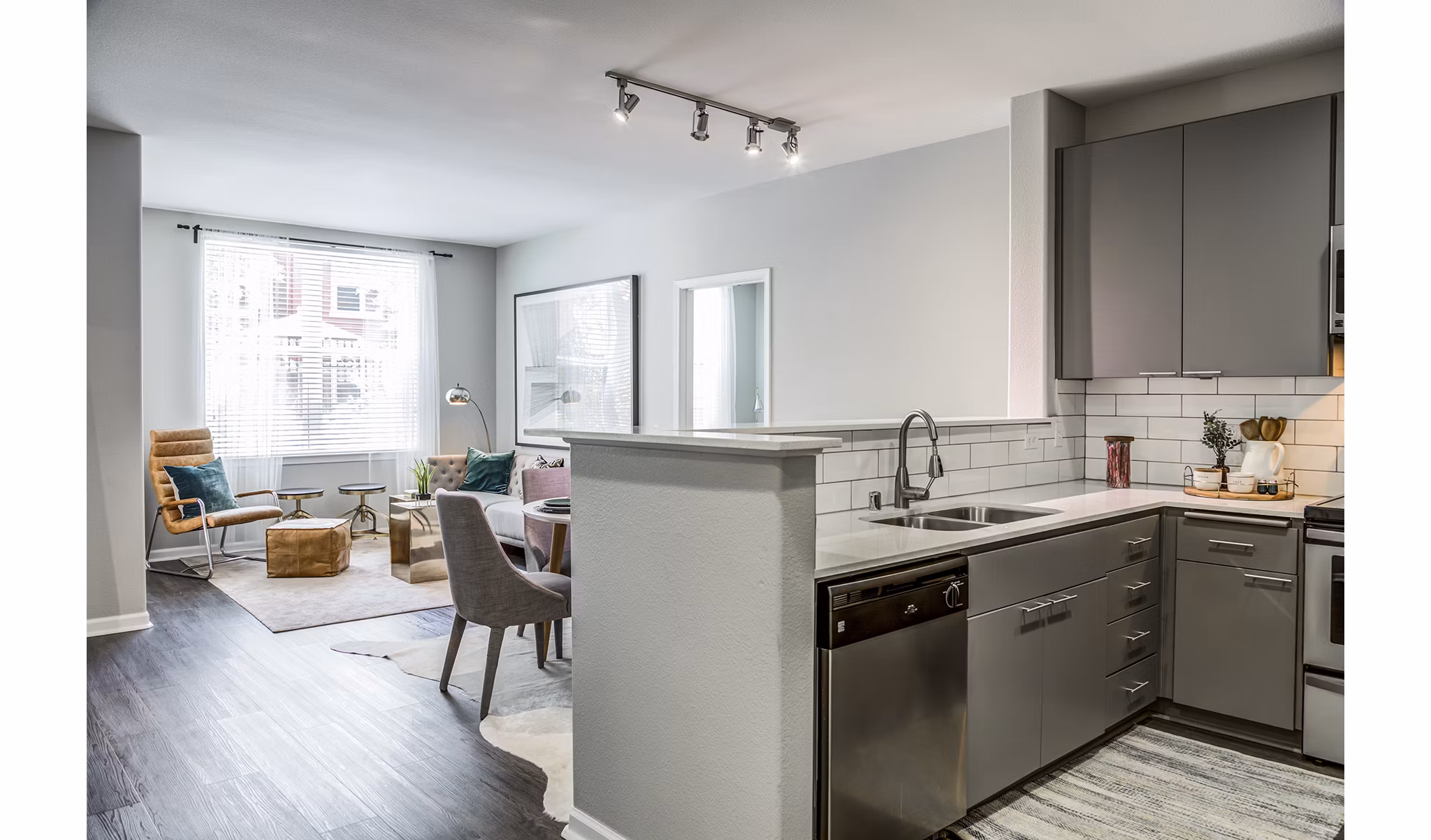 Modern kitchen with stainless steel appliances at Acappella Apartments