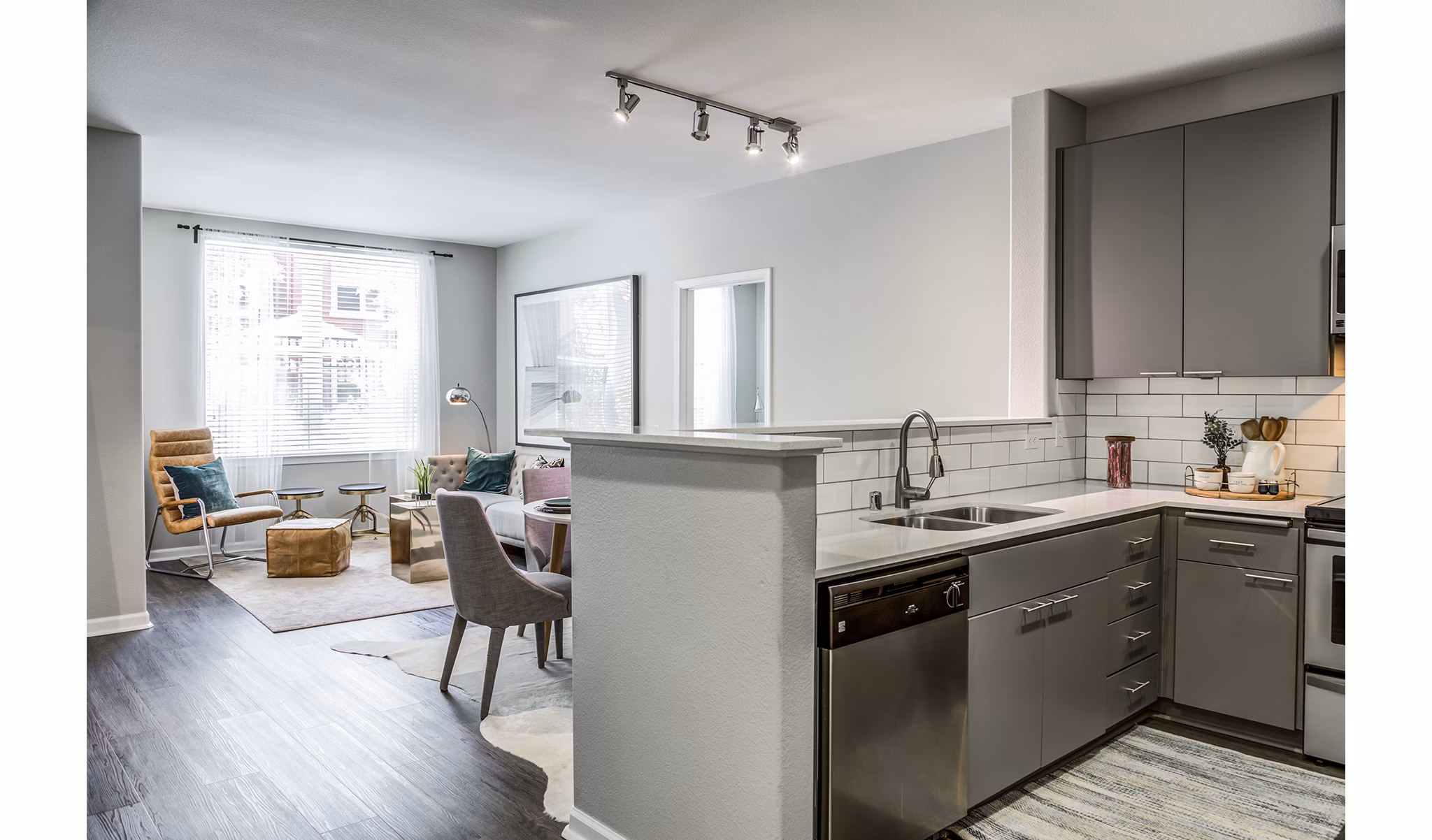 Modern kitchen with stainless steel appliances at Acappella Apartments