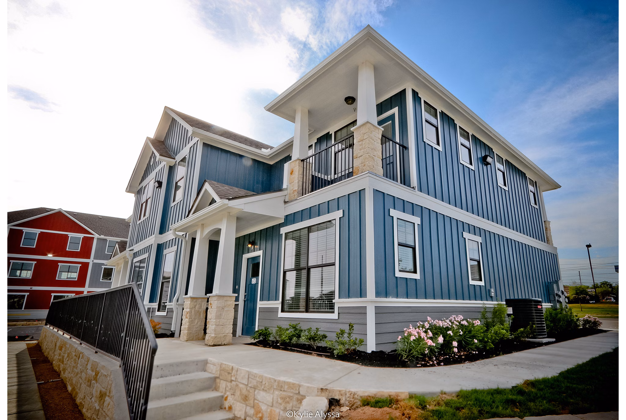 Camber Villas: Elegant view of luxury apartments in vibrant neighborhood