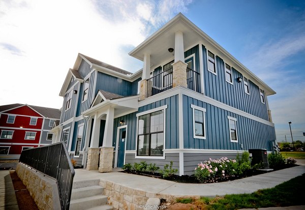 Camber Villas: Elegant view of luxury apartments in vibrant neighborhood