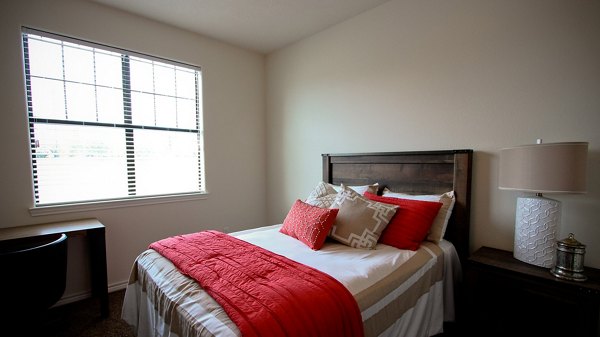 Cozy bedroom with stylish decor in Camber Villas luxury apartments, creating a comfortable living space for residents