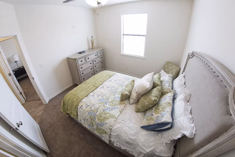 Cozy bedroom featuring modern furnishings at Camber Villas luxury apartments