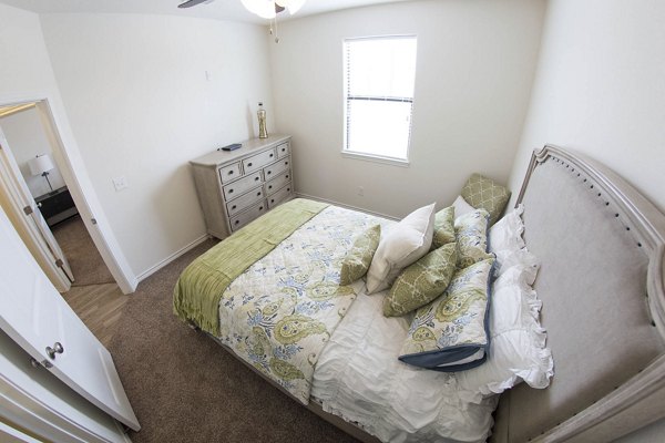 Cozy bedroom featuring modern furnishings at Camber Villas luxury apartments