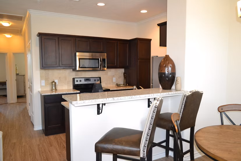 Dining area with modern furnishings at Camber Villas luxury apartments