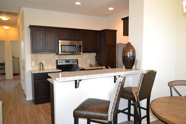 Dining area with modern furnishings at Camber Villas luxury apartments