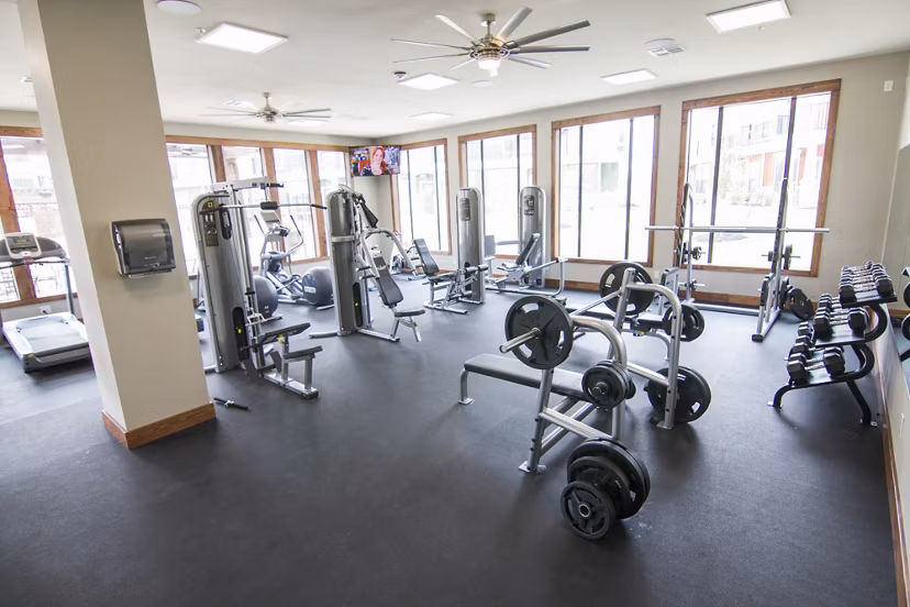 Modern fitness center with state-of-the-art equipment at Camber Villas, luxury apartments by Greystar