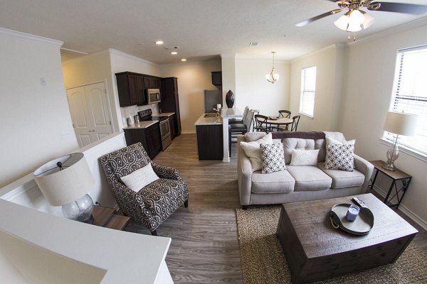 Spacious living room with modern furnishings in Camber Villas apartments