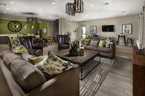 Clubhouse with modern design and plush seating at Terrano Apartments, perfect for community gatherings and social events