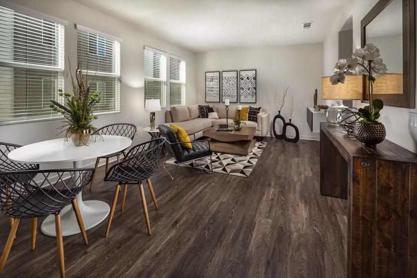 Dining room with contemporary lighting and sleek furnishings at Terrano Apartments