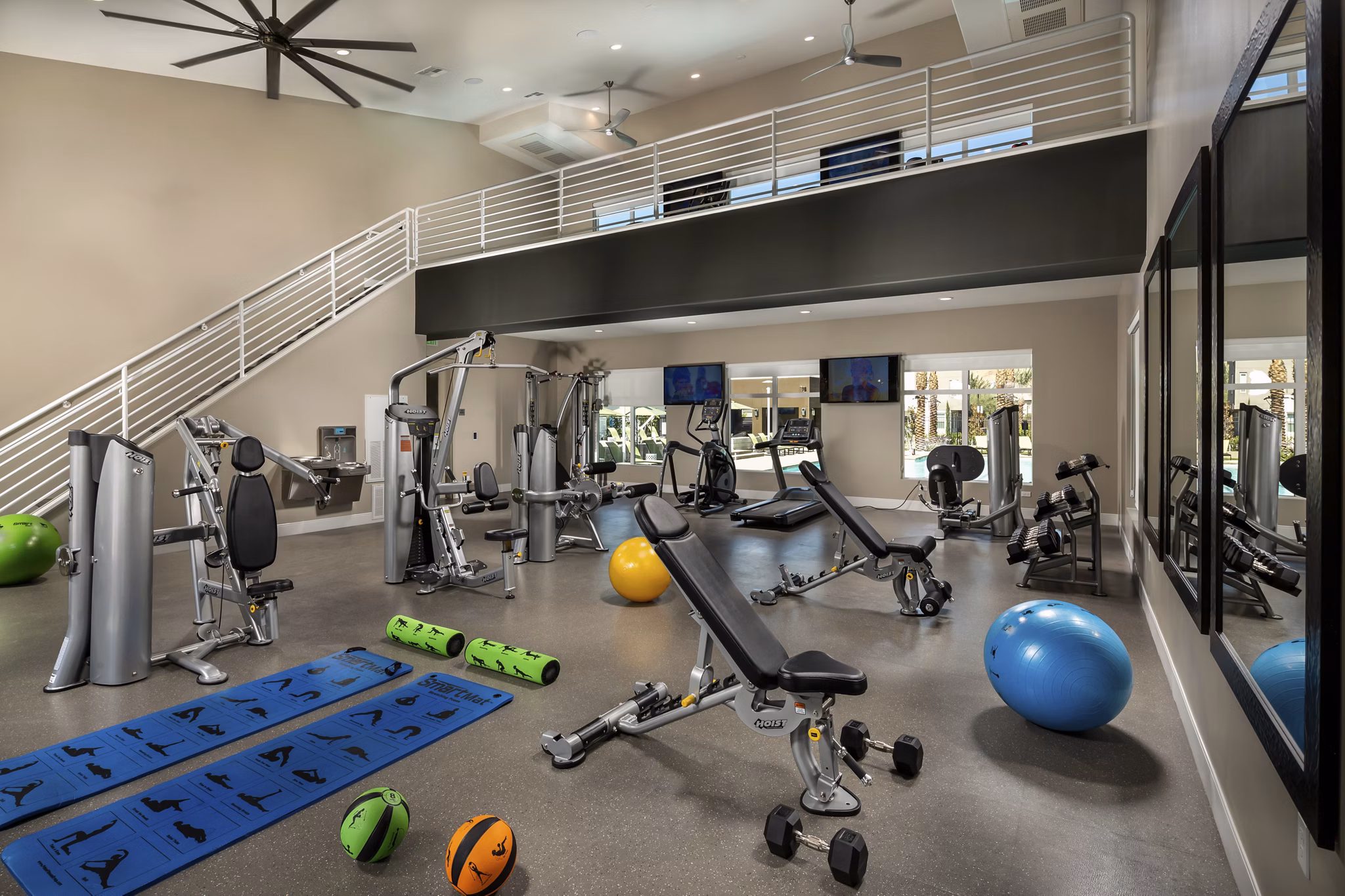 Modern fitness center with advanced equipment at Terrano Apartments