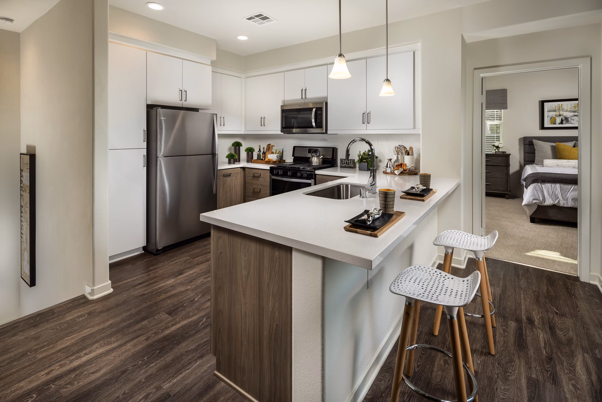 Modern kitchen with stainless steel appliances at Terrano Apartments